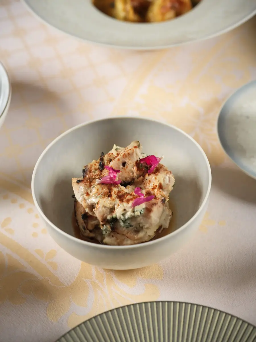 Biryani served in a bowl, damask tablecloth